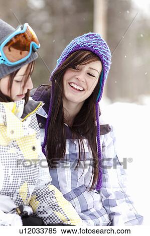 Teen girls in snowboard clothing View Large Photo Image Stock Photography - Teen girls in snowboard clothing. Fotosearch