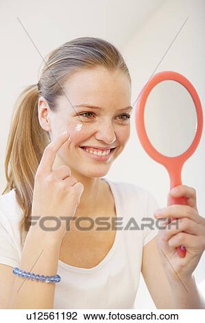 Teenage girl applying makeup View Large Photo Image Stock Image - Teenage girl applying makeup. Fotosearch