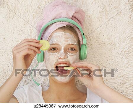 Stock Photo - Teenage girl wearing beauty mask. Fotosearch