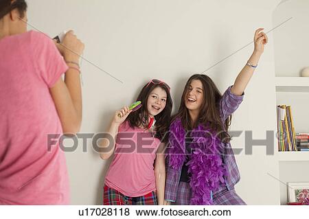 teenage girls singing, wearing pajamas View Large Photo Image Stock Photo - teenage girls singing, wearing pajamas. Fotosearch
