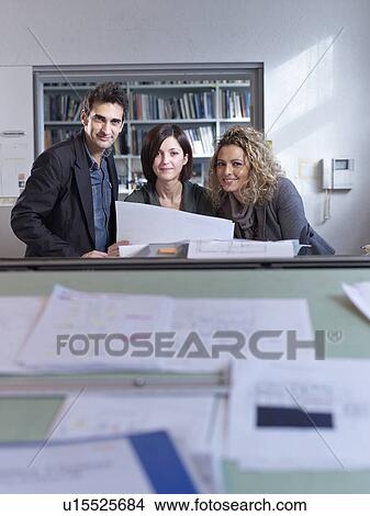 The colleagues working in office View Large Photo Image Picture - The colleagues working in office. Fotosearch
