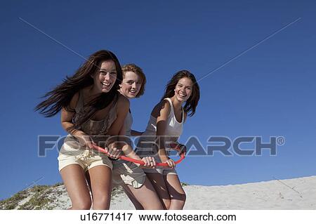 Stock Photo - Three girls in hoop. Fotosearch