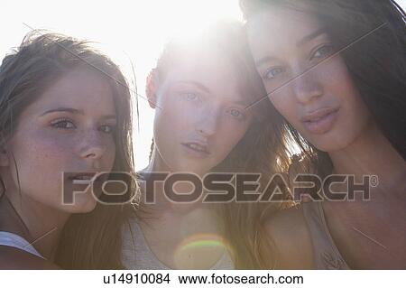 Picture - Three girls looking in camera. Fotosearch