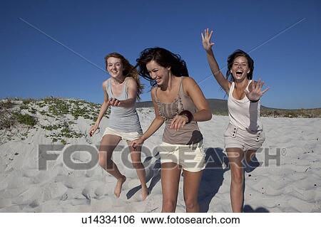 Three girls running towards camera View Large Photo Image Stock Photograph - Three girls running towards camera. Fotosearch