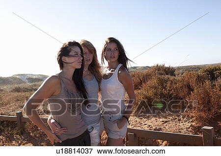 Three girls standing close View Large Photo Image Stock Photo - Three girls standing close. Fotosearch