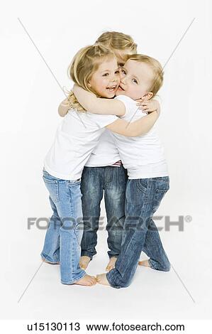 Three toddler girls hugging View Large Photo Image Stock Image - Three toddler girls hugging. Fotosearch