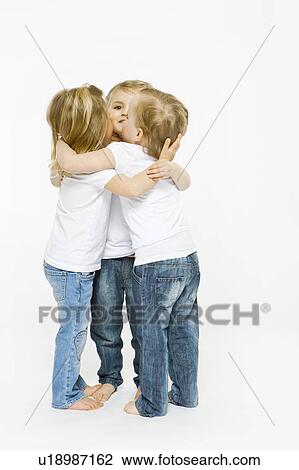 Three toddler girls hugging View Large Photo Image Stock Image - Three toddler girls hugging. Fotosearch