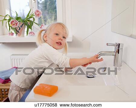 Toddler girl washing her hands View Large Photo Image Stock Photo - Toddler girl washing her hands. Fotosearch