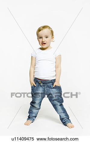 Toddler girl with hands in pockets View Large Photo Image Stock Photography - Toddler girl with hands in pockets. Fotosearch