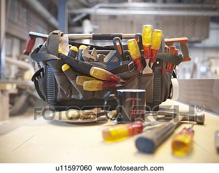 Tool kit with cup of tea and biscuits View Large Photo Image Stock Image - Tool kit with cup of tea and biscuits. Fotosearch