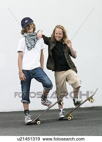 Stock Photo - Two boys with skateboards. Fotosearch