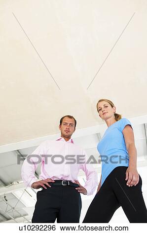 Two business colleagues in bright office View Large Photo Image Stock Photograph - Two business colleagues in bright office. Fotosearch