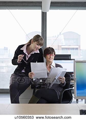 Two business women in a meeting View Large Photo Image Stock Image - Two business women in a meeting. Fotosearch