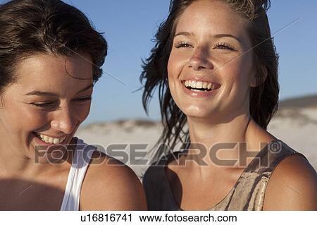 Two girls laughing View Large Photo Image Stock Image - Two girls laughing. Fotosearch