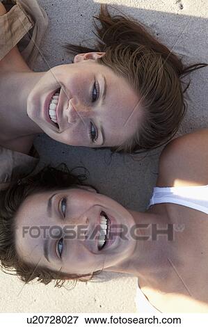 Two girls laughing View Large Photo Image Stock Photo - Two girls laughing. Fotosearch