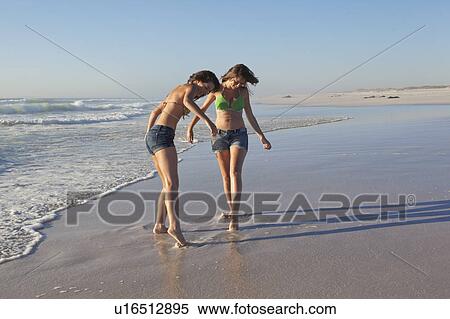 Two girls on beach View Large Photo Image Stock Photography - Two girls on beach. Fotosearch