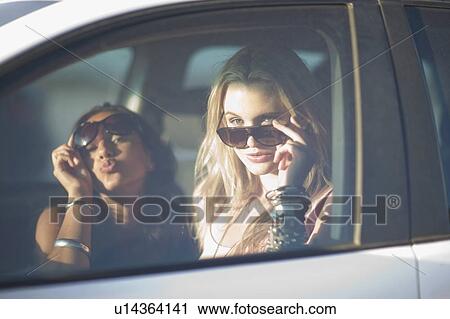 two girls with shades in car View Large Photo Image Stock Image - two girls with shades in car. Fotosearch