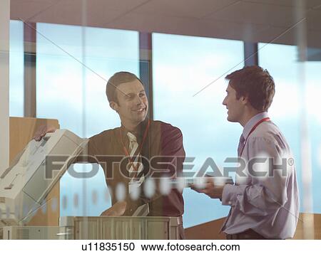 Two men at photocopier View Large Photo Image Stock Image - Two men at photocopier. Fotosearch