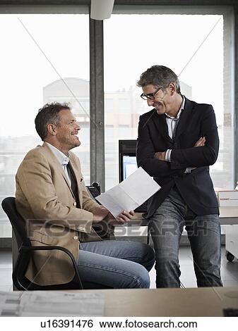 Two men in a meeting View Large Photo Image Stock Photograph - Two men in a meeting. Fotosearch
