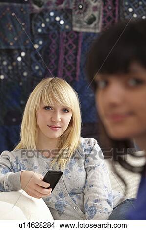 Picture - Two relaxed women looking to camera. Fotosearch