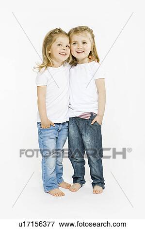 Two toddler girls hugging View Large Photo Image Stock Photo - Two toddler girls hugging. Fotosearch
