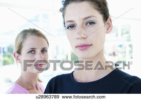 Two women in office View Large Photo Image Stock Photo - Two women in office. Fotosearch