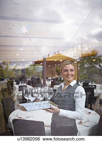 Waitress in restaurant View Large Photo Image Stock Photograph - Waitress in restaurant. Fotosearch