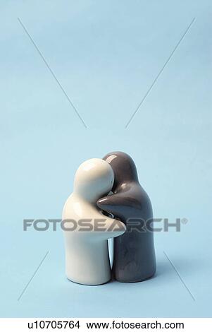 White and grey model figures hugging View Large Photo Image Picture - White and grey model figures hugging. Fotosearch
