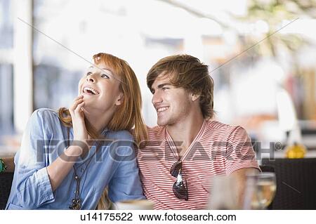 Woman and man sitting in a cafe View Large Photo Image Stock Image - Woman and man sitting in a cafe. Fotosearch