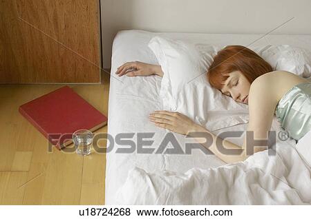 woman asleep in bed View Large Photo Image Stock Photo - woman asleep in bed. Fotosearch