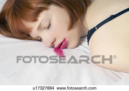 woman asleep with smudged lipstick View Large Photo Image Picture - woman asleep with smudged lipstick. Fotosearch