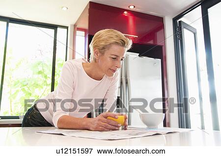Stock Photo - Woman at breakfast. Fotosearch