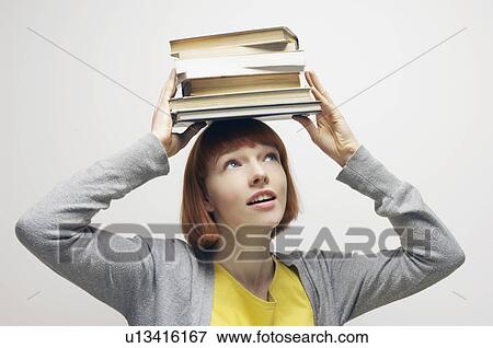woman balancing books on head View Large Photo Image Stock Photo - woman balancing books on head. Fotosearch