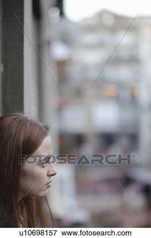 Stock Photo - Woman by the window. Fotosearch