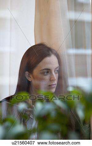 Woman by the window View Large Photo Image Stock Photo - Woman by the window. Fotosearch