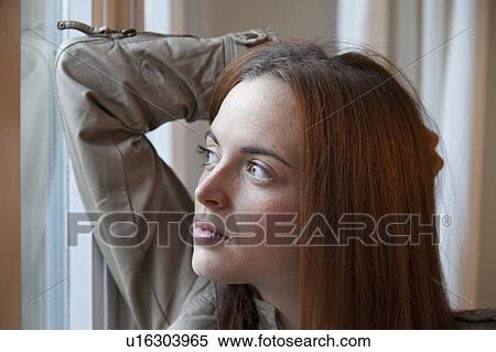 Woman by the window View Large Photo Image Stock Photography - Woman by the window. Fotosearch