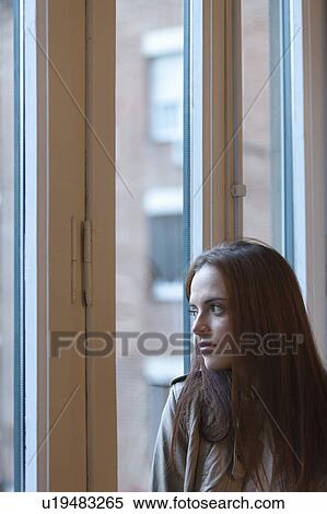 Stock Photography - Woman by the window. Fotosearch