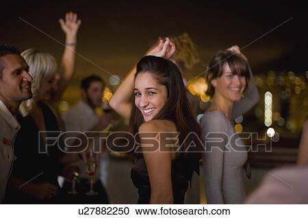 Woman dancing at party at night View Large Photo Image Stock Image - Woman dancing at party at night. Fotosearch