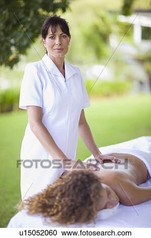 Woman doing a massage View Large Photo Image Stock Image - Woman doing a massage. Fotosearch