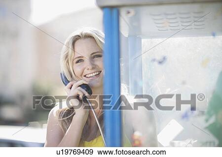 Woman doing a phone call View Large Photo Image Stock Photo - Woman doing a phone call. Fotosearch