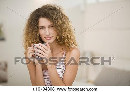 Woman drinking cup of coffee View Large Photo Image Stock Photo - Woman drinking cup of coffee. Fotosearch