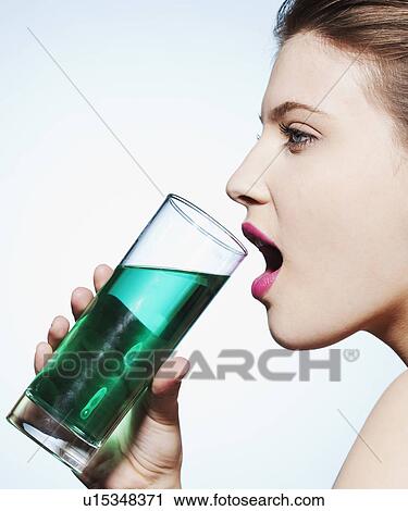Woman drinking glass of water View Large Photo Image Stock Image - Woman drinking glass of water. Fotosearch