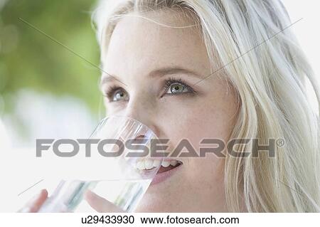 Stock Image - Woman drinking water. Fotosearch
