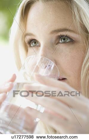 Woman drinking water View Large Photo Image Stock Photo - Woman drinking water. Fotosearch