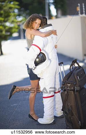Woman embracing an astronaut View Large Photo Image Stock Photograph - Woman embracing an astronaut. Fotosearch