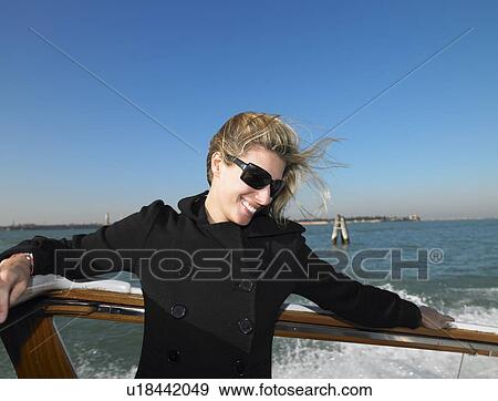 Woman enjoying the boat ride View Large Photo Image Stock Photo - Woman enjoying the boat ride. Fotosearch