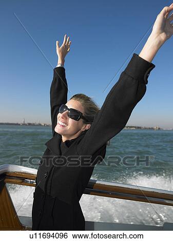 Woman enjoying the boat ride View Large Photo Image Stock Photograph - Woman enjoying the boat ride. Fotosearch