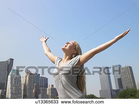 Stock Image - Woman enjoying the breeze on a hot day. Fotosearch