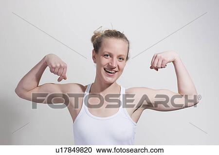 Woman flexing muscles View Large Photo Image Stock Image - Woman flexing muscles. Fotosearch