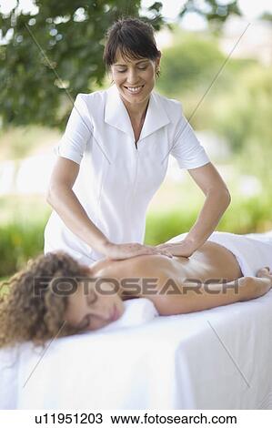 Stock Image - Woman getting a massage. Fotosearch